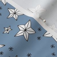 Origami Christmas stars - Star shaped ornaments and snowflakes white on moody blue