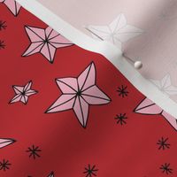 Origami Christmas stars - Star shaped ornaments and snowflakes pink on red