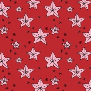 Origami Christmas stars - Star shaped ornaments and snowflakes pink on red