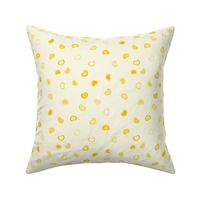 Scattered dark to Light yellow ombre hearts on a pastel yellow background