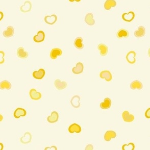 Scattered dark to Light yellow ombre hearts on a pastel yellow background