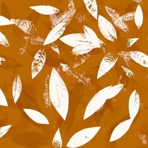 White silhouettes of leaves on orange