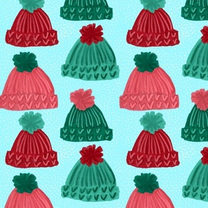 Winter Hats with Pom Poms on Turquoise Background