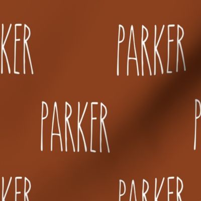 custom name - white font on rust background - Parker