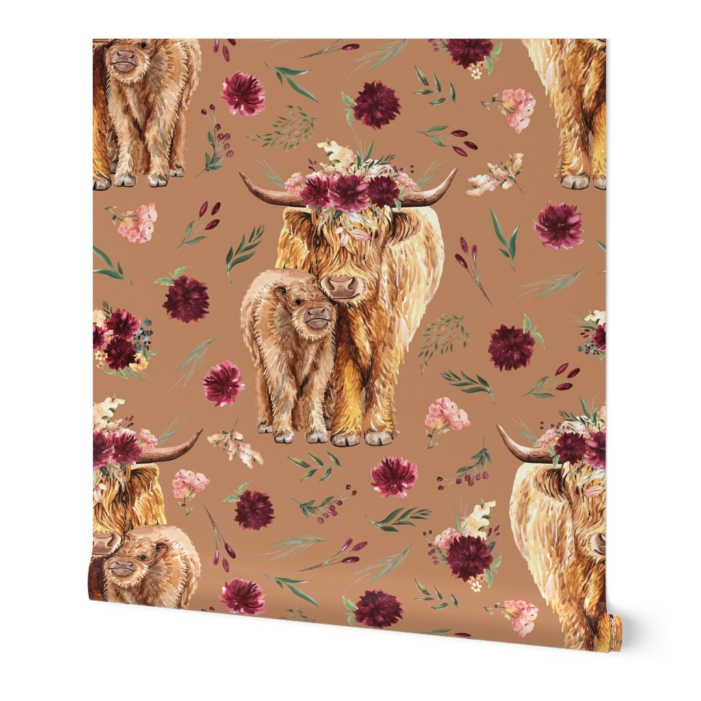 maroon floral highland cow on sandstone