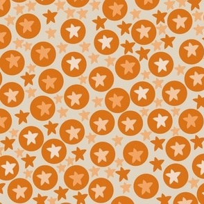 Tanning tangerine circles and dots with sand background