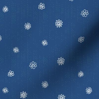 scattered white flowers on dark blue | medium