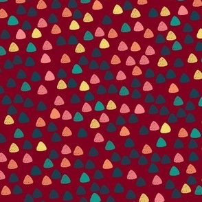Gum drops with burgundy background