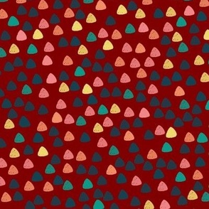 Gum drops with maroon background