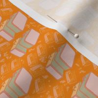 Suitcases and maps with tangerine background