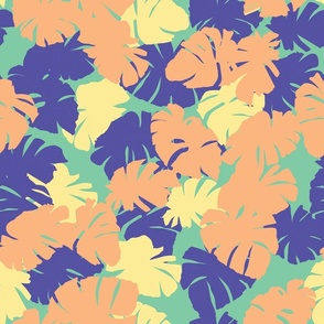 Seamless repeating pattern of colorful tropical leaves