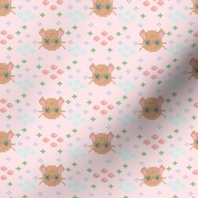 cross stich brown cat and flowers on candy colored canvas