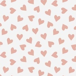 Small scale dusty pink tossed hearts on cream white.
