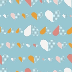 Pink, mustard and cream white Valentine hearts in a row on sky blue