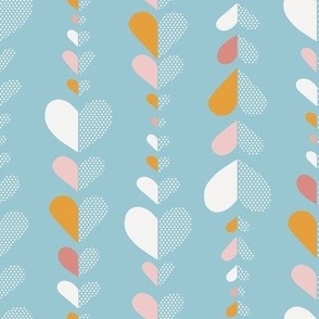 Stacked Valentine Hearts in white, mustard and pink on light sky blue