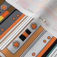 Cassette tapes on orange