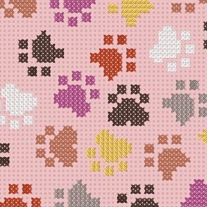 Normal scale // Pawsome cross stitch // cotton candy pink background yellow brown berry and peony pink paw prints