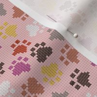 Small scale // Pawsome cross stitch // cotton candy pink background yellow brown berry and peony pink paw prints