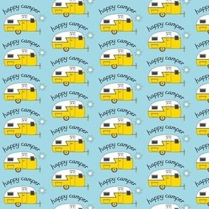 yellow  happy camper trailer on baby blue