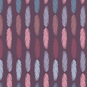 Colourful feathers in line on a maroon background