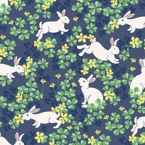 Bunny Hop - The Year of the Rabbit - White Bunny Rabbits Hop in a Field of Green Clover and Yellow Flowers