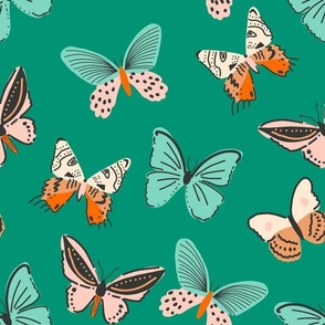 butterfly flying insects in turquoise tan blush orange spring summer on emerald green