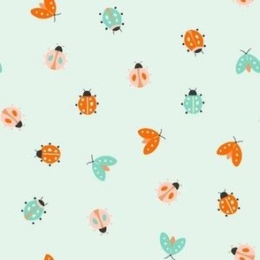 small cute beetle winged insect ladybug summer june bugs on blue green