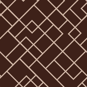 Geometric shapes formed by a maze of connecting lines sand on brown