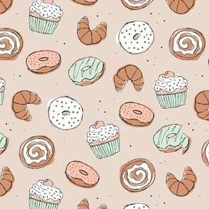 The sweet minimalist baker - croissants cupcakes cinnamon bun and donuts baked goods design coral mint on sand