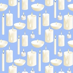 Various Candles on Cornflower Blue