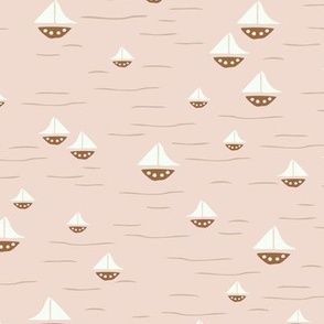 Dreamy sailboats on pink water
