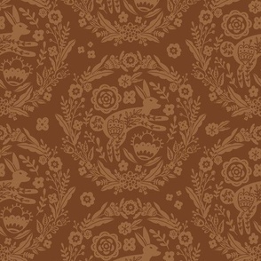 Folk Art Bunny and Floral Wreath in light brown on an earth brown background