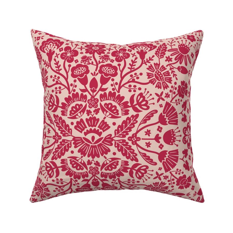 Symmetrical floral folk art pattern in viva magenta on a dusty pink background