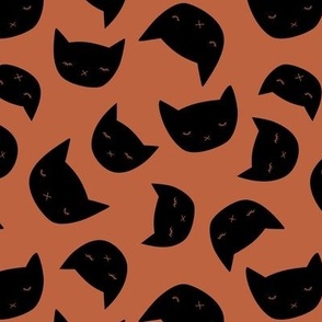 Cutesy cats - minimalist black cat design retro kawaii style halloween theme on burnt orange vintage red