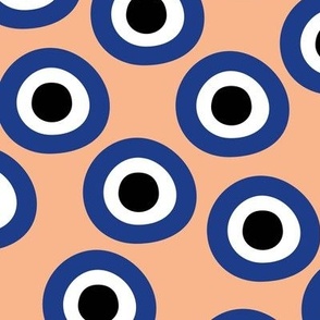 Minimalist retro evil eye - irregular large circles and dots arabic abstract symbol on soft peach