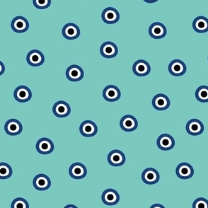 Minimalist retro evil eye - irregular circles and dots arabic abstract symbol on turquoise teal blue