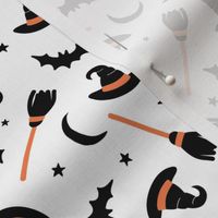 Witches hats broomstick bat stars and moon halloween design minimalist design orange black on white