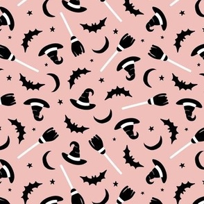 Witches hats broomstick bat stars and moon halloween design minimalist design black and white on pink blush