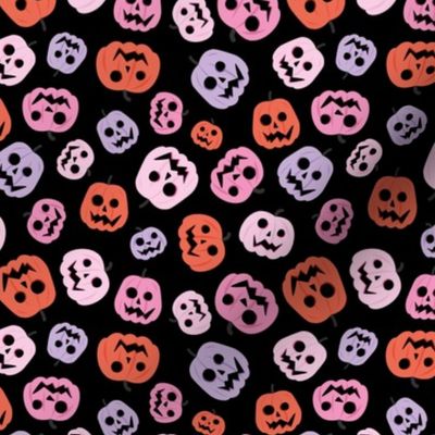 Spooky carved halloween pumpkins - cutesy style boho retro fall design orange lilac blush on black night