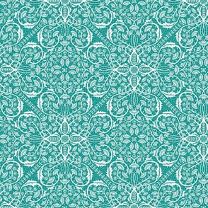 Classic ornate floral vines with symmetry - teal and white.