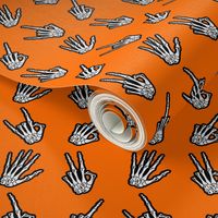 Bone Zone orange skeleton hand pattern
