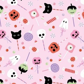 Colorful cutesy halloween lollipop - candy and sweets with skulls pumpkins ghosts cats and bloody eyes on retro mint link lilac 