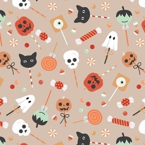 Colorful cutesy halloween lollipop - candy and sweets with skulls pumpkins ghosts cats and bloody eyes on vintage beige orange palette 