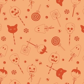 Halloween sweets and candy - ghosts cats zombies and pumpkins for fright night cutesy kawaii style lollipop tangerine on peach 