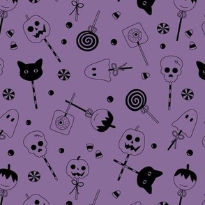 Halloween sweets and candy - ghosts cats zombies and pumpkins for fright night cutesy kawaii style lollipop  black on purple 