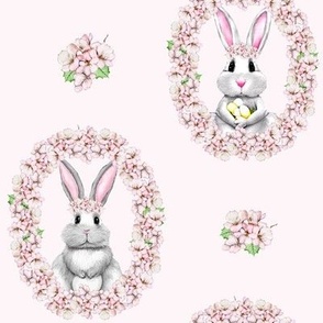 Cute bunnies in a wreath of cherry blossoms