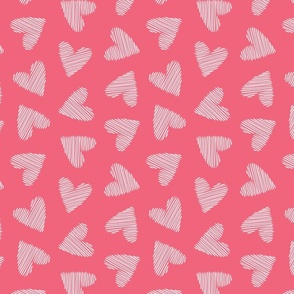 White scribbled hearts on a pink background