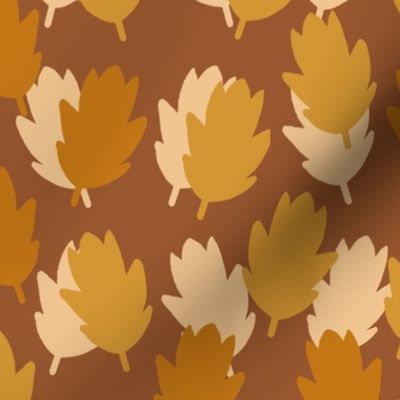 Falling Leaves on a Brown background. Golden, yellow and cream leaves