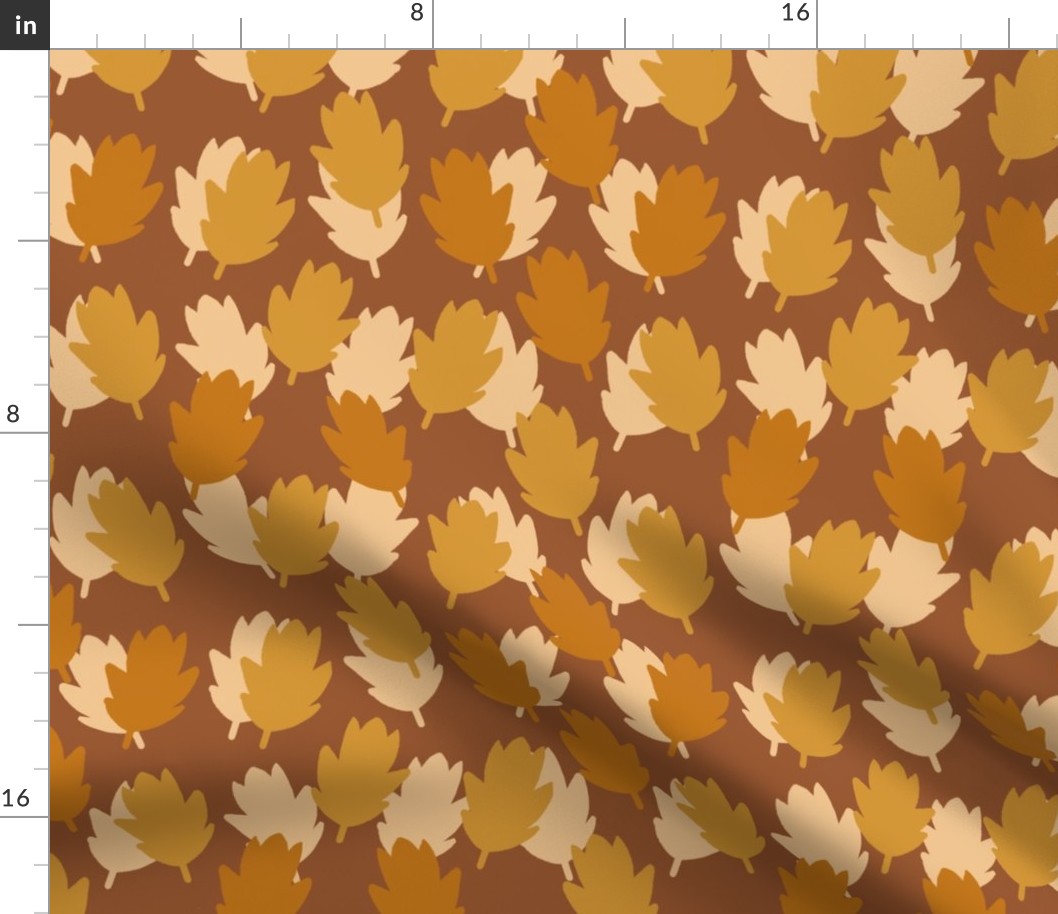 Falling Leaves on a Brown background. Golden, yellow and cream leaves
