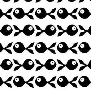 small - little fish swimming in black and white